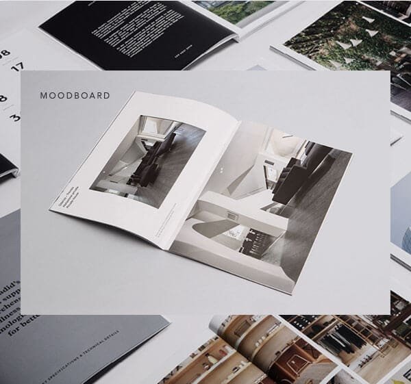 open magazine on gray table showing housing interiors