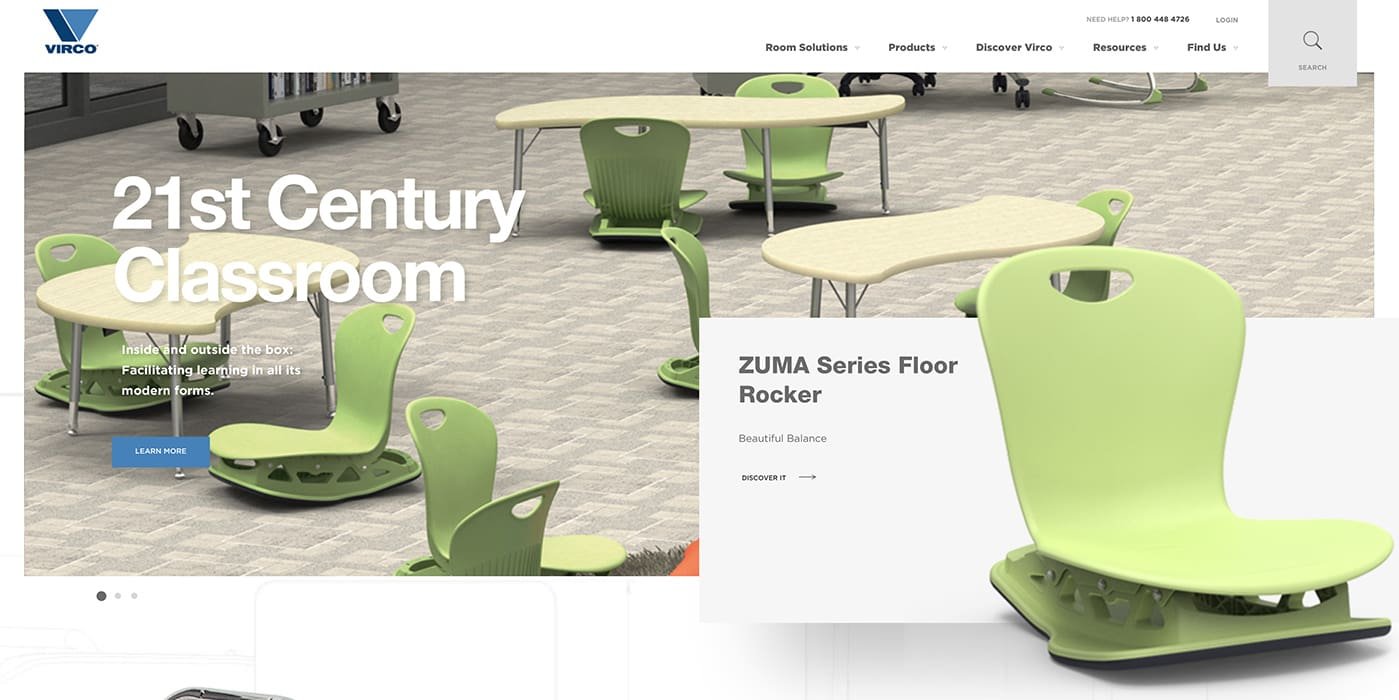 green chair in the foreground and a classroom in the background