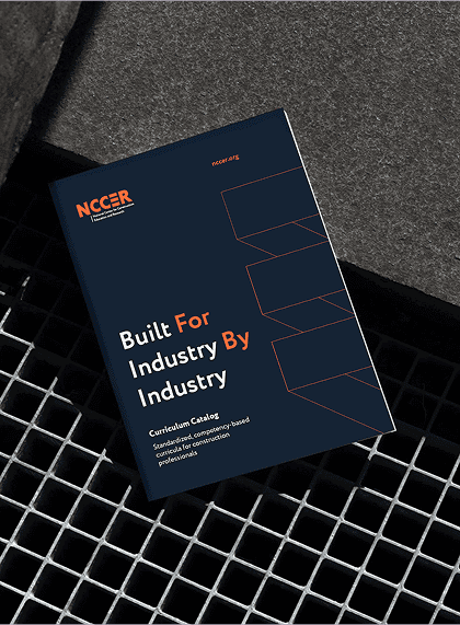 Custom-designed NCCER book cover showcasing bold typography and vibrant visuals reflecting the organization’s updated brand identity.